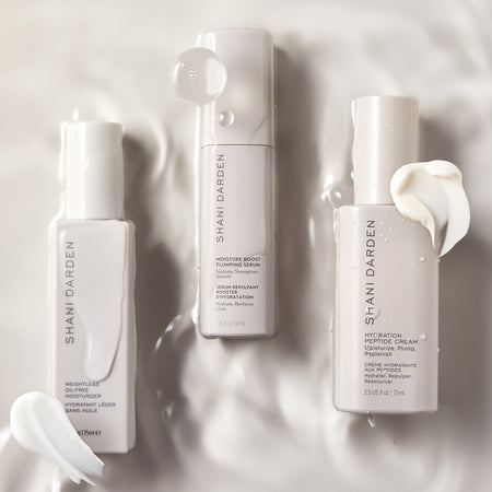 Moisture Boost Plumping Serum, Hydration Peptide Cream, & Weightless Oil-free Moisturizer on water