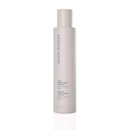 Shani Darden Sake Nourishing Essence bottle with minimalist packaging, labeled to hydrate, brighten, and soften skin