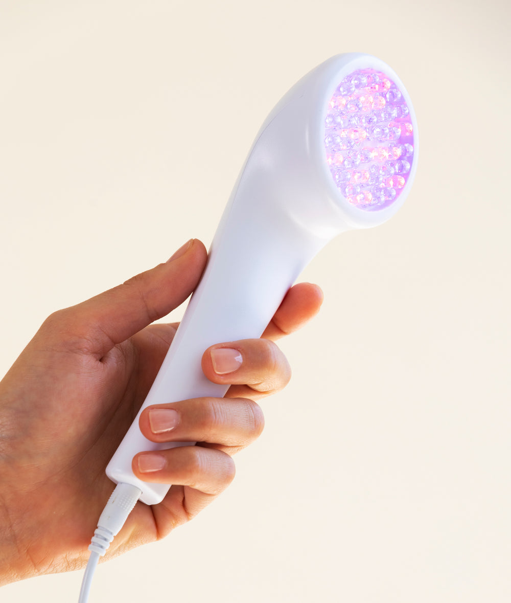 lightstim for acne in hand - on