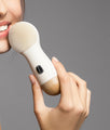 model holding opus luxe cleansing brush