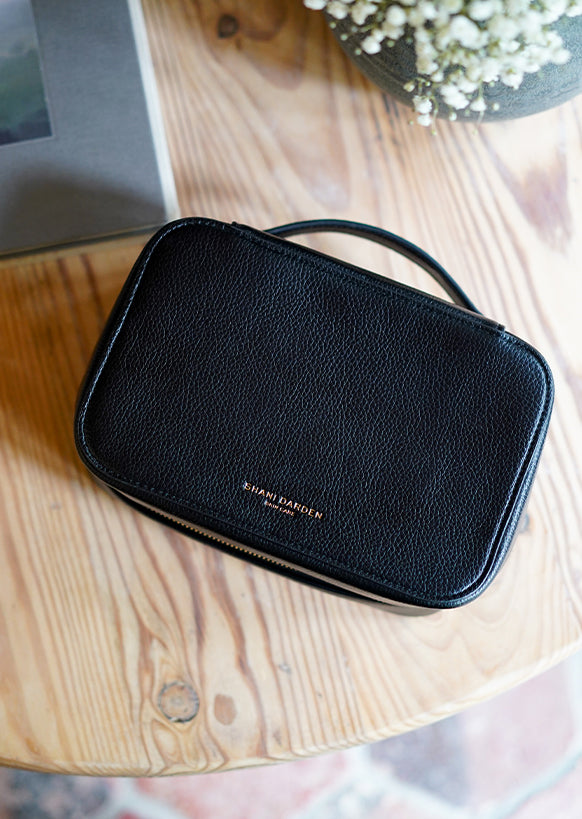 the facial sculpting wand travel case on a table