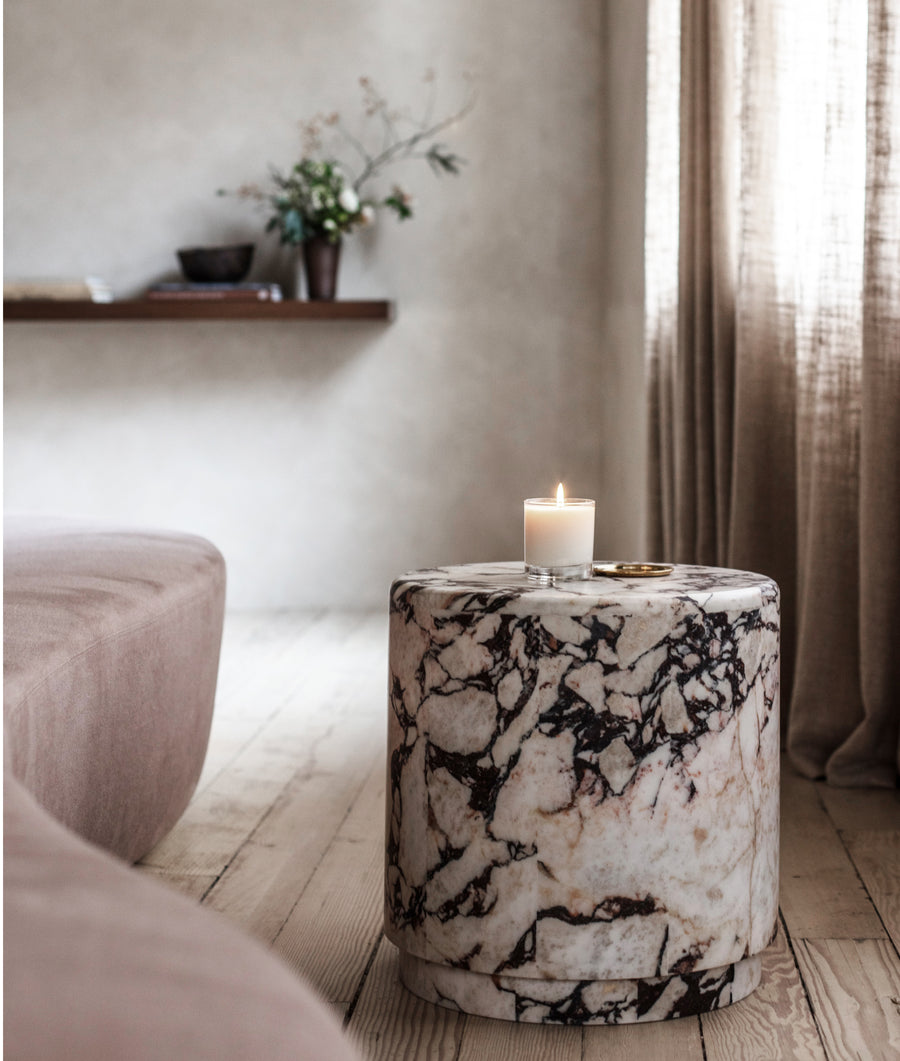 amberlily candle lit on table
