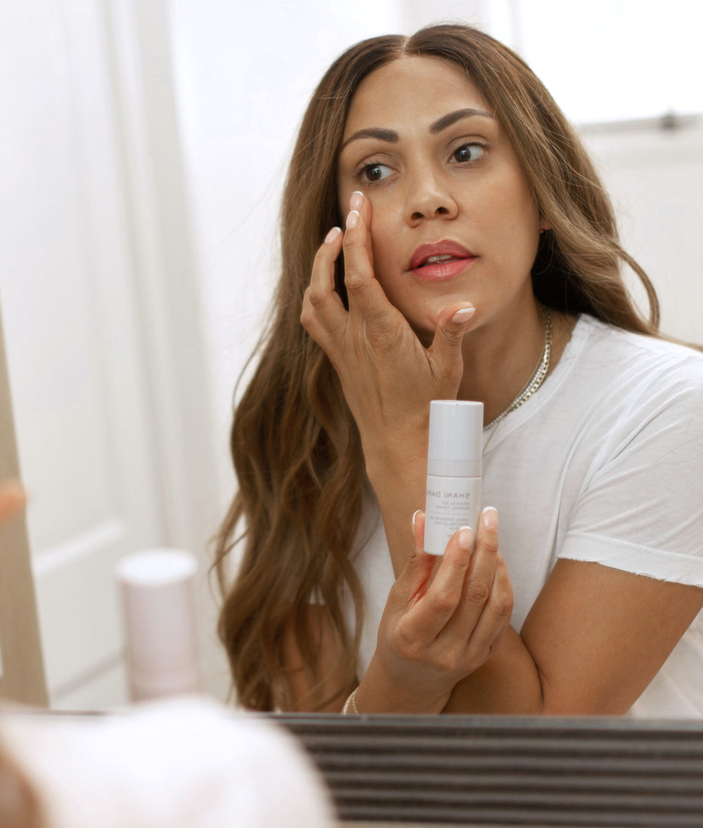 shani darden applying intensive eye renewal cream