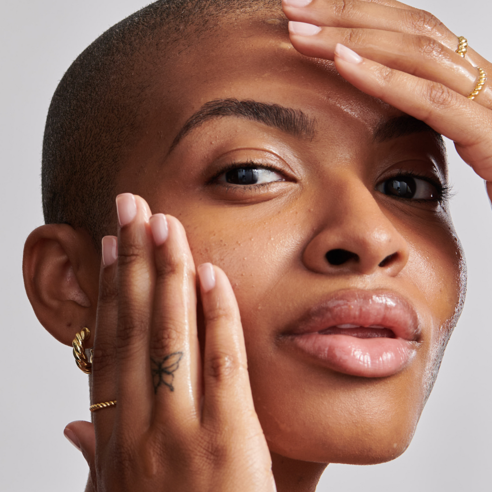 Close up of model's face showing texture and facial oils
