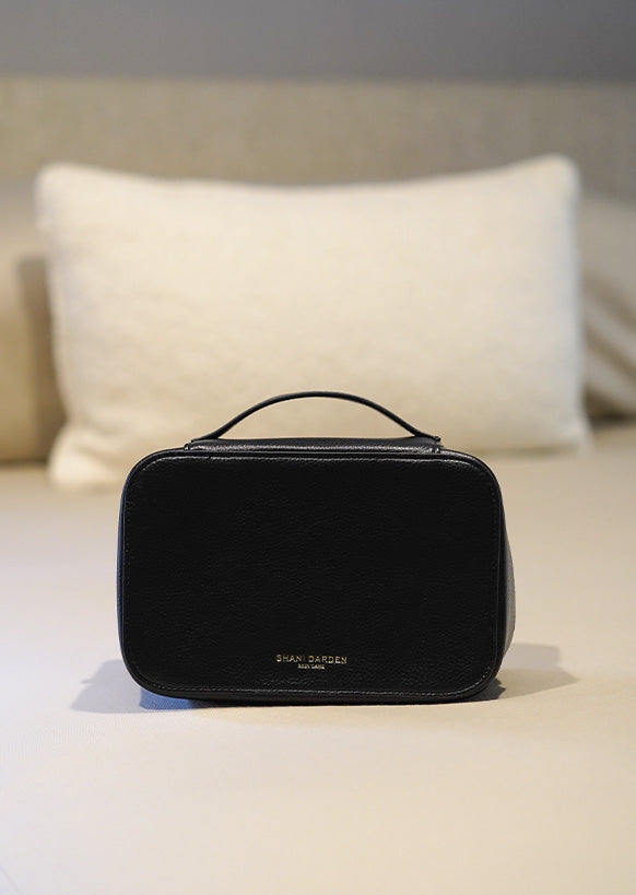 The Travel Case on the bed