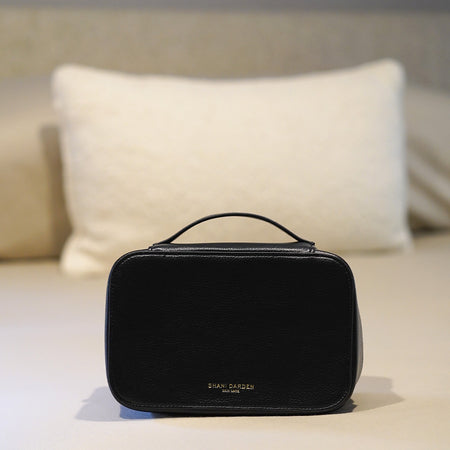 The Travel Case on the bed