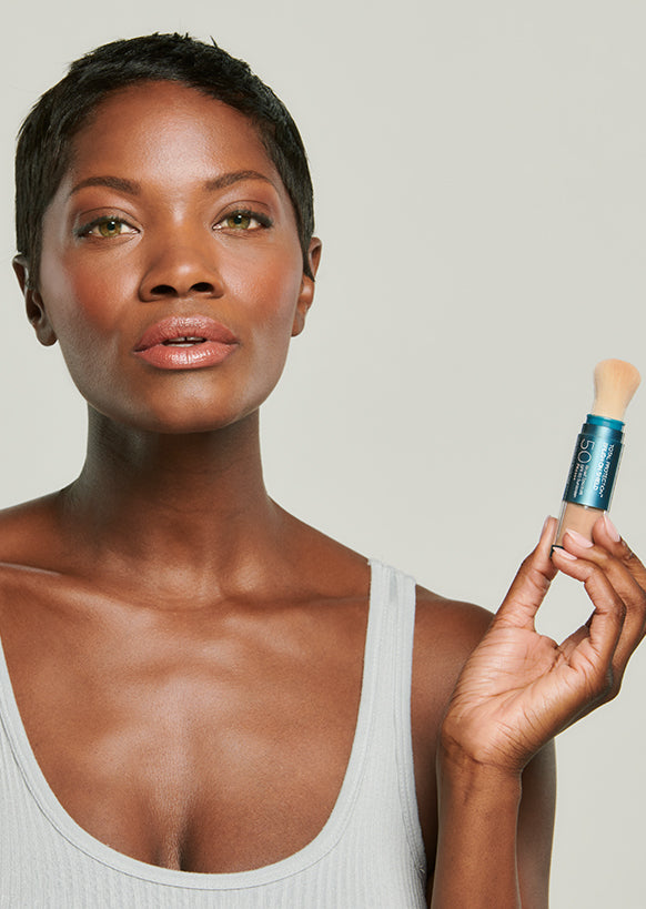 brush-on shield spf 50 with model